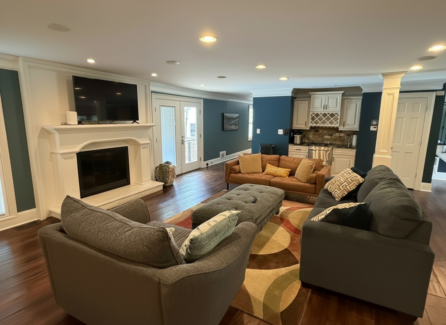 Gather with loved ones in this spacious living area, where you can unwind on plush sofas, enjoy a movie, or cozy up by the fireplace.